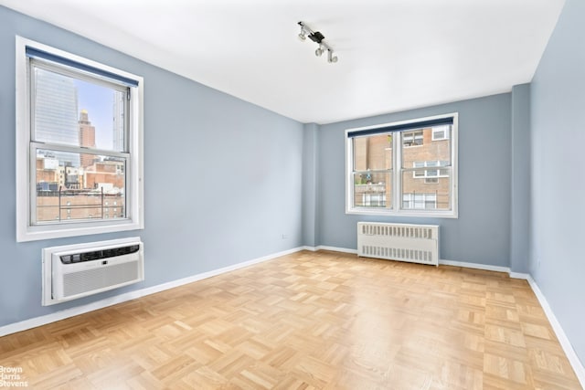 160 E 27th St Unit 11E, New York City, NY 10016 - empty room with radiator and an AC wall unit