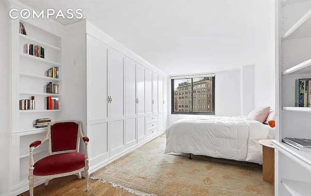 40 E 94th St Unit 13G, New York City, NY 10128 - bedroom featuring wood finished floors
