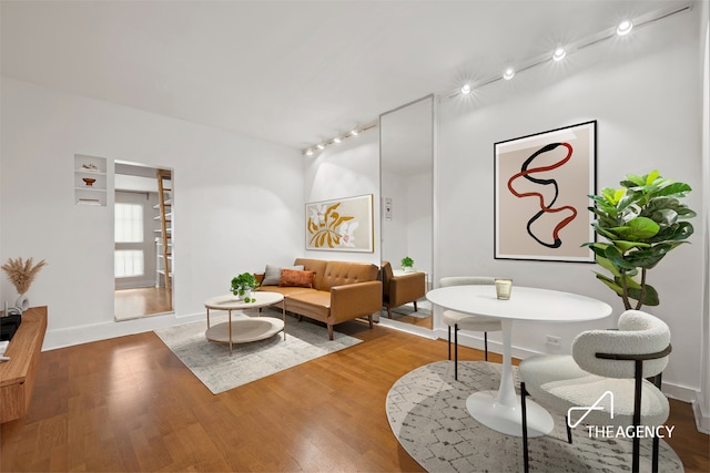 138 E 36th St Unit 1B, New York City, NY 10016 - living area with track lighting and wood finished floors