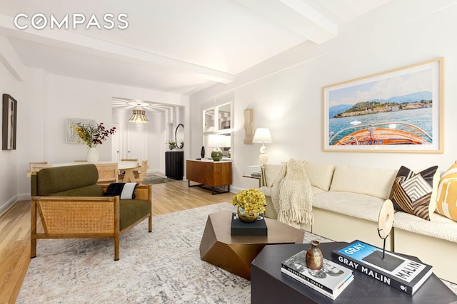400 E 52nd St Unit 10K, New York City, NY 10022 - living room with wood finished floors and beam ceiling