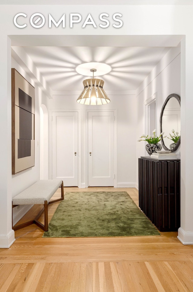 400 E 52nd St Unit 10K, New York City, NY 10022 - hall featuring light wood-type flooring and baseboards
