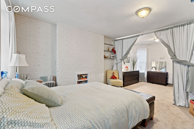 514 W 50th St Unit 5Rw, New York City, NY 10019 - bedroom featuring brick wall and light colored carpet