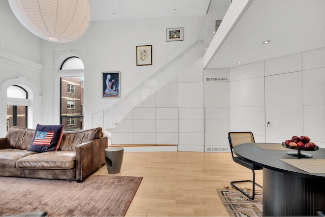 242 E 7th St Ph, Ph, New York City, NY 10009 - living area featuring light wood finished floors and a high ceiling