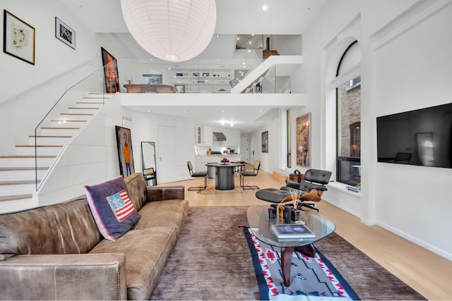 242 E 7th St Ph, Ph, New York City, NY 10009 - living area with stairway and a towering ceiling
