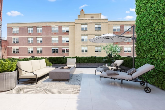 242 E 7th St Ph, Ph, New York City, NY 10009 - view of patio / terrace with an outdoor living space with a fire pit