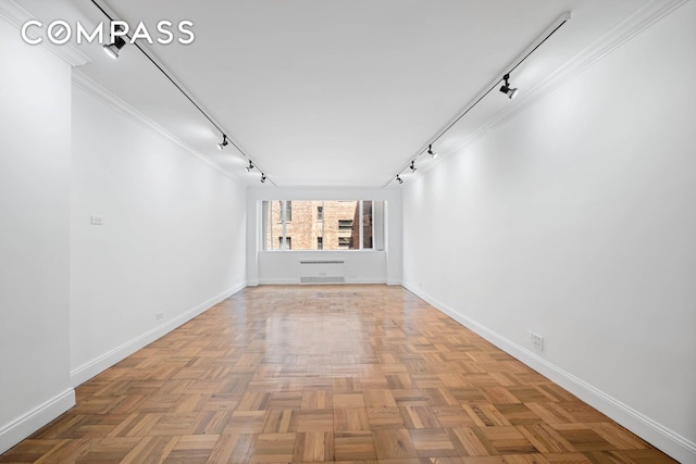 333 E 69th St Unit 3A, New York City, NY 10021 - hallway featuring rail lighting and baseboards