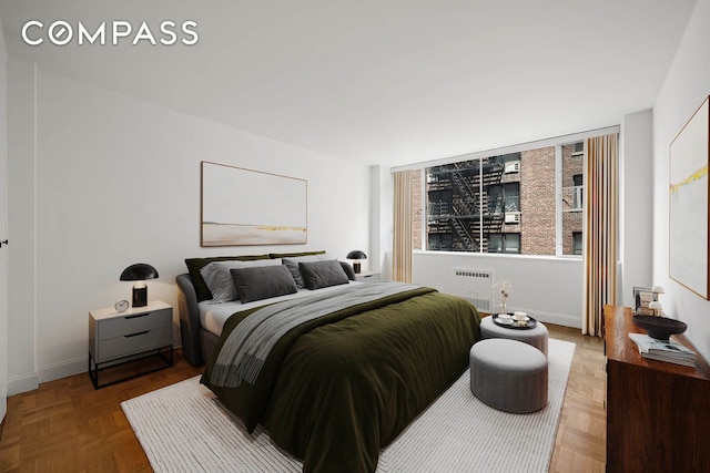 333 E 69th St Unit 3A, New York City, NY 10021 - bedroom featuring radiator heating unit and baseboards
