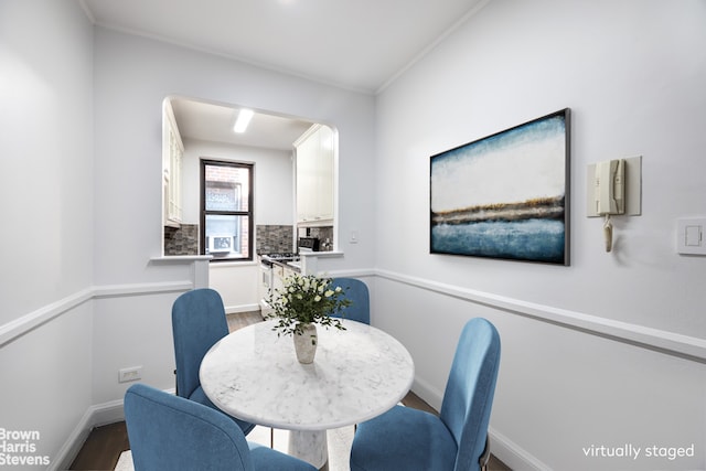 349 E 49th St Unit 6P, New York City, NY 10017 - dining space with wood finished floors and arched walkways