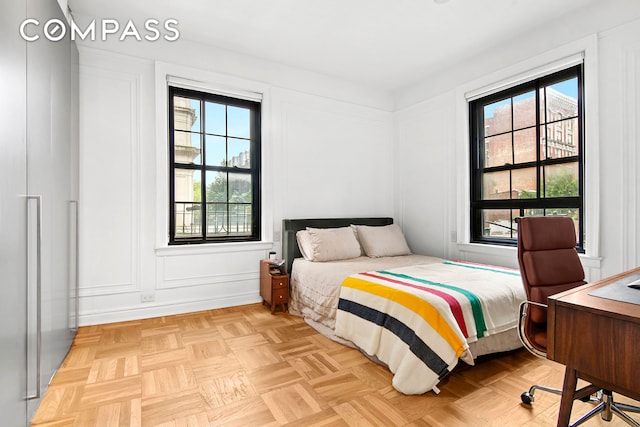 205 Hicks St Unit 2B, New York City, NY 11201 - bedroom featuring multiple windows and a decorative wall