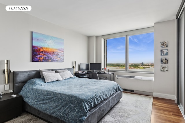 30 Little W St Unit 24A, New York City, NY 10004 - bedroom with wood finished floors and baseboards