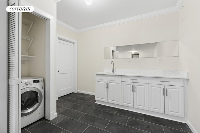 555 Lenox Ave Unit 1A, New York City, NY 10037 - washroom featuring washer / dryer, ornamental molding, and dark tile patterned floors