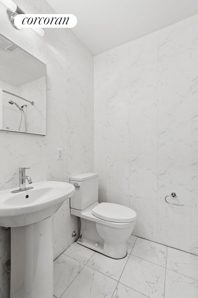 555 Lenox Ave Unit 1A, New York City, NY 10037 - bathroom with marble finish floors and toilet