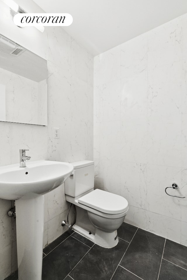 555 Lenox Ave Unit 1A, New York City, NY 10037 - half bathroom with toilet and a sink