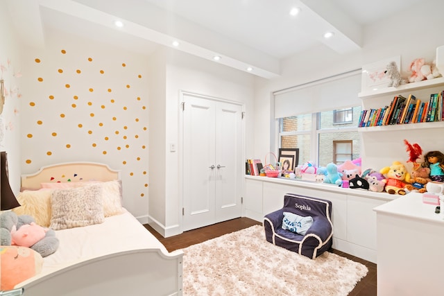 229 E 79th St Unit 7-B, New York City, NY 10075 - bedroom featuring recessed lighting, dark wood finished floors, and a closet