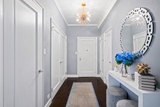 229 E 79th St Unit 7-B, New York City, NY 10075 - foyer entrance featuring a chandelier, dark wood finished floors, and ornamental molding