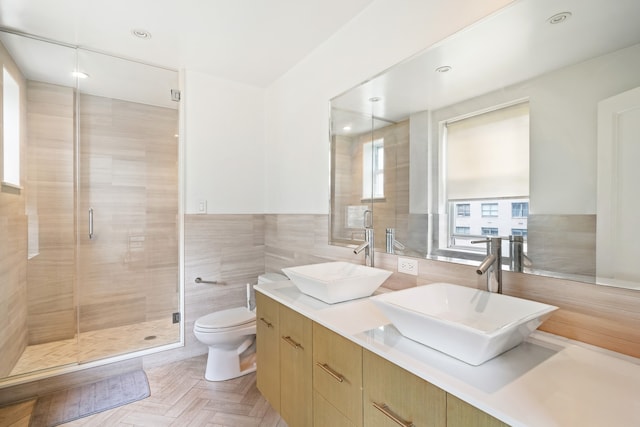 229 E 79th St Unit 7-B, New York City, NY 10075 - full bath with tile walls, double vanity, and a stall shower