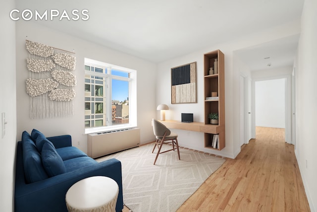 304 W 115th St Unit 6A, New York City, NY 10026 - office with light wood-style floors and radiator heating unit
