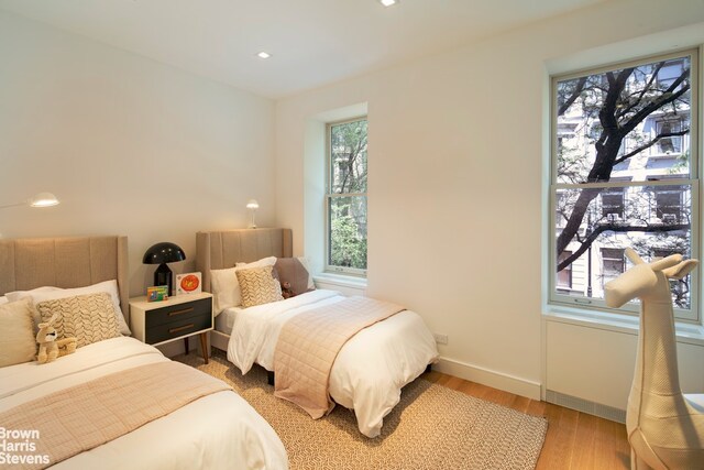 6 W 95th St, New York City, NY 10025 - bedroom featuring light wood-style floors and recessed lighting