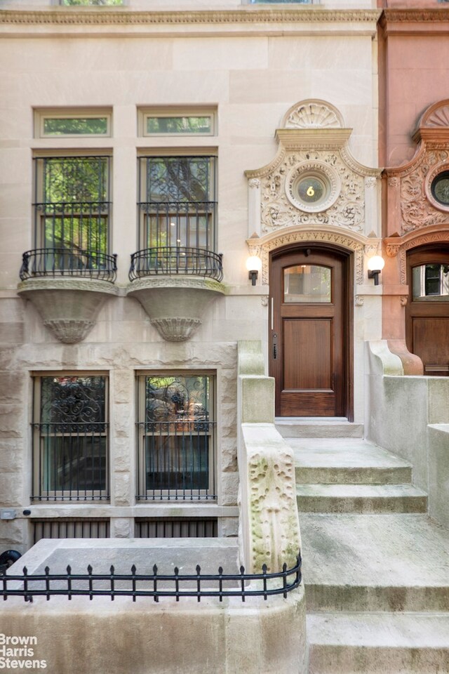 6 W 95th St, New York City, NY 10025 - view of exterior entry featuring a balcony and stone siding