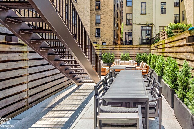 6 W 95th St, New York City, NY 10025 - view of patio / terrace with stairs, outdoor dining area, and an outdoor living space