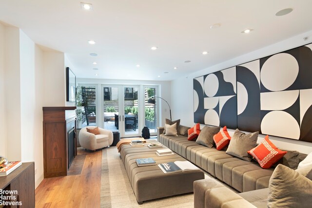 6 W 95th St, New York City, NY 10025 - living room with light wood-type flooring, a fireplace, and recessed lighting
