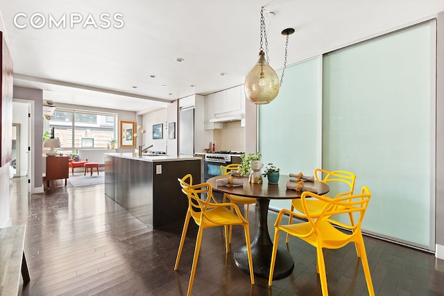 88 Morningside Ave Unit 8E, New York City, NY 10027 - dining area featuring dark wood-style floors and baseboards
