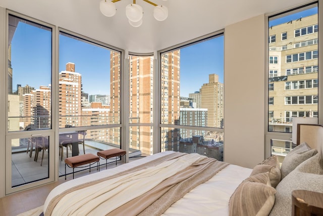 250 E 25th St Ph-A, Ph-A New York City, NY 10010 - bedroom with a wall of windows, a view of city, and wood finished floors