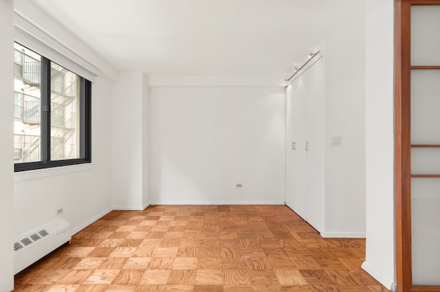 16 W 16th St Unit 7Rn, New York City, NY 10011 - spare room with a baseboard heating unit and baseboards