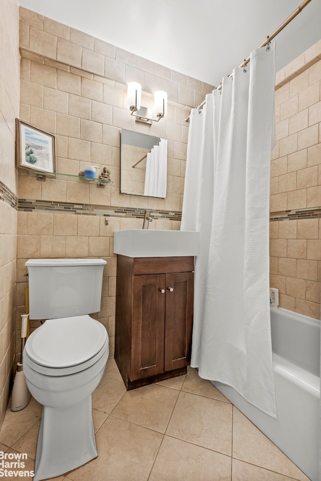 3103 Fairfield Ave Unit 4A, New York City, NY 10463 - full bathroom with tile patterned floors, vanity, shower / bath combination with curtain, and tile walls