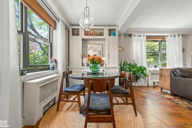 3103 Fairfield Ave Unit 4A, New York City, NY 10463 - dining space featuring a chandelier, plenty of natural light, and ornamental molding
