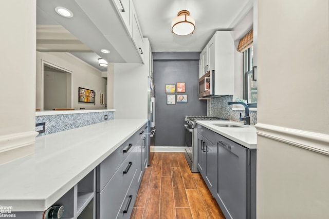 3103 Fairfield Ave Unit 4A, New York City, NY 10463 - kitchen with stainless steel appliances, gray cabinets, tasteful backsplash, light countertops, and recessed lighting