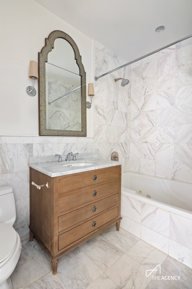 42 Main St Unit 2B, New York City, NY 11201 - full bathroom featuring tile walls, a combined bath / shower with jetted tub, and vanity