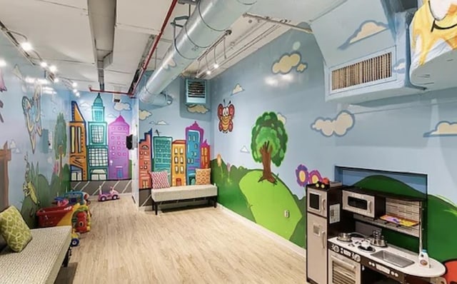 21-45 44th Dr Unit 4-C, New York City, NY 11101 - playroom with wood finished floors