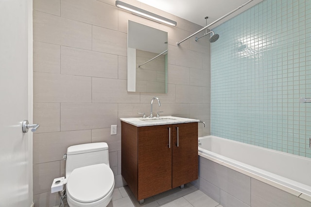 21-45 44th Dr Unit 4-C, New York City, NY 11101 - bathroom featuring tile walls, vanity, tiled shower / bath, and tile patterned floors