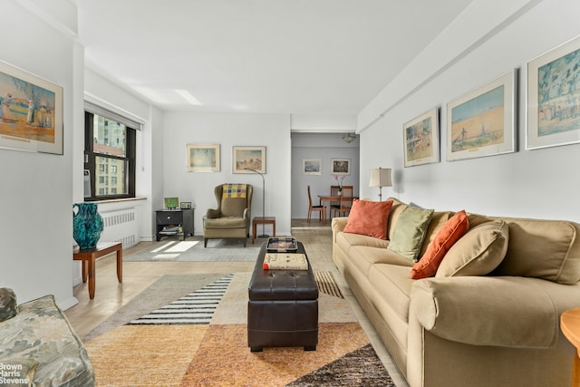 11 Riverside Dr Unit 14Ow, New York City, NY 10023 - living area featuring radiator heating unit and light wood-style flooring