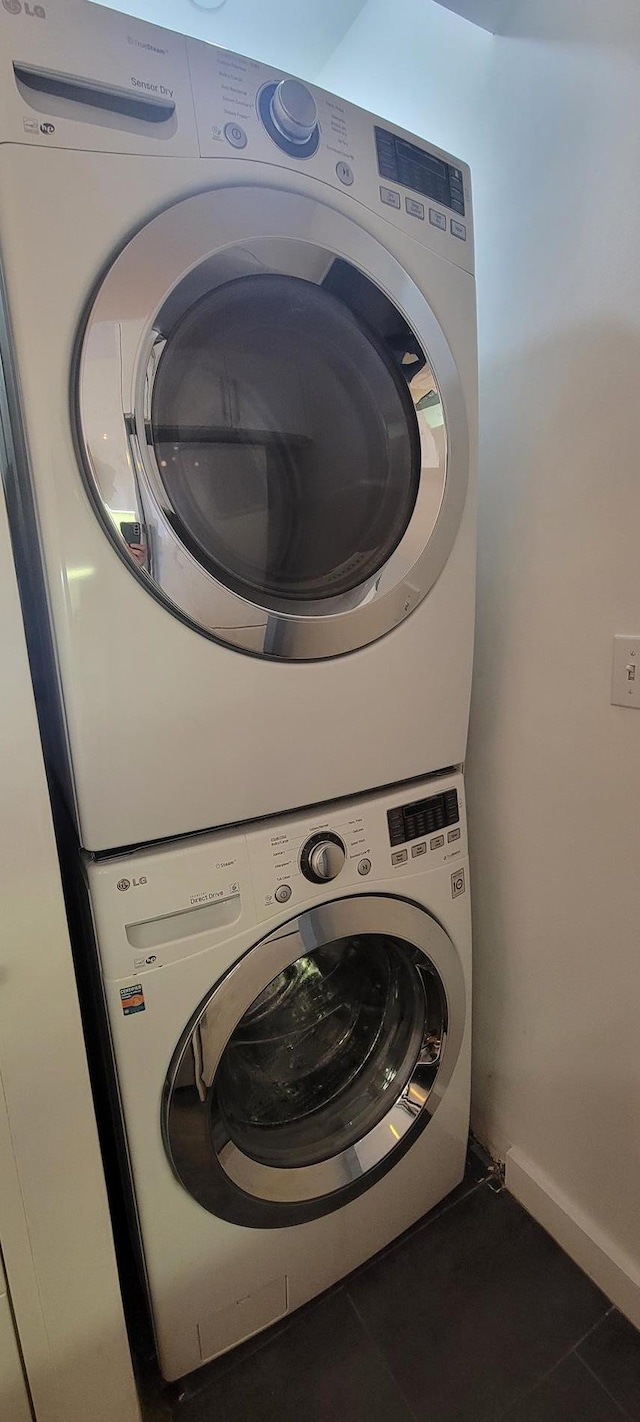 870 Pacific St Unit 3-F, New York City, NY 11238 - washroom featuring estacked washer and dryer and tile patterned floors
