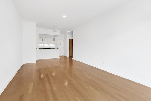 870 Pacific St Unit 3-F, New York City, NY 11238 - unfurnished living room featuring light wood-style floors and recessed lighting