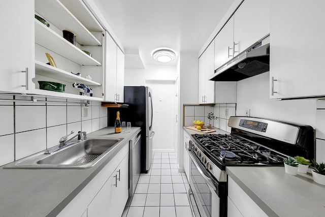 111 E 85th St Unit 3-A, New York City, NY 10028 - kitchen with appliances with stainless steel finishes, under cabinet range hood, open shelves, light tile patterned floors, and white cabinetry