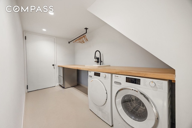 125 Rutland Rd, New York City, NY 11225 - laundry area with washer and dryer and recessed lighting