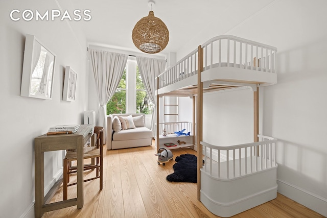 125 Rutland Rd, New York City, NY 11225 - bedroom with wood finished floors