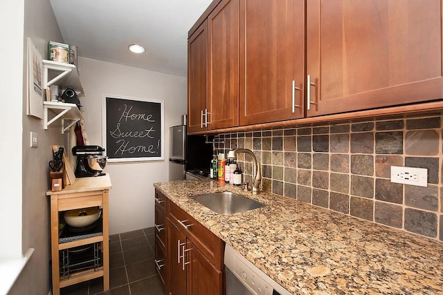 741 W End Ave Unit 3C, New York City, NY 10025 - kitchen featuring backsplash, light stone countertops, dark tile patterned floors, brown cabinetry, and recessed lighting