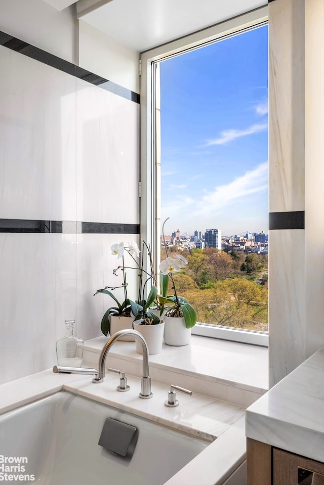 1212 5th Ave Unit 14A, New York City, NY 10029 - bathroom featuring a sink and a view of city