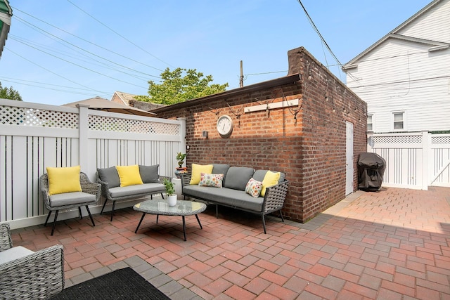 100-15 Ascan Ave, New York City, NY 11375 - fenced backyard featuring an outdoor hangout area, a patio, and grilling area