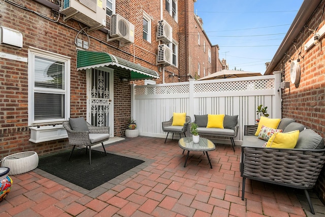 100-15 Ascan Ave, New York City, NY 11375 - view of patio / terrace featuring an outdoor living space and cooling unit