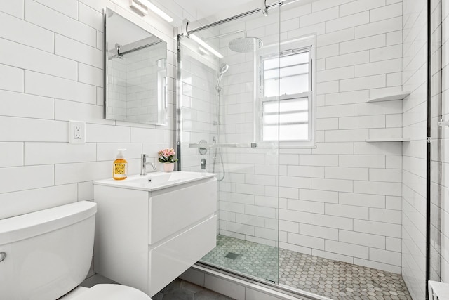 100-15 Ascan Ave, New York City, NY 11375 - full bathroom featuring a stall shower, vanity, and tile walls