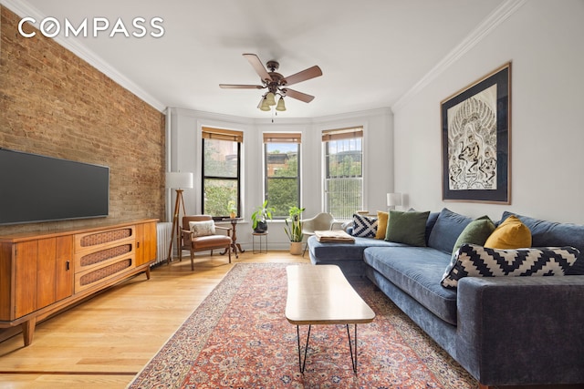 466 15th St Unit 8, New York City, NY 11215 - living area featuring ornamental molding, light wood-type flooring, ceiling fan, radiator, and brick wall