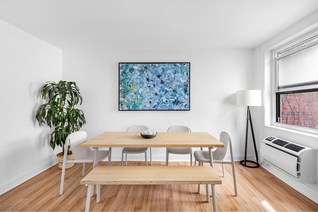 708 Washington St Unit 5B, New York City, NY 10014 - dining space featuring light wood-style flooring and an AC wall unit