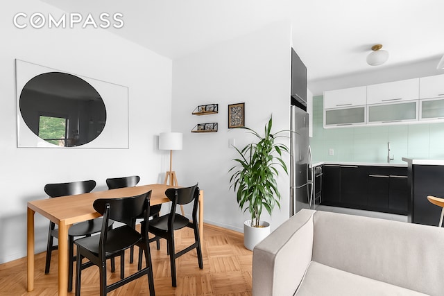 394 Lincoln Pl Unit C2, New York City, NY 11238 - dining room with baseboards and bar with sink