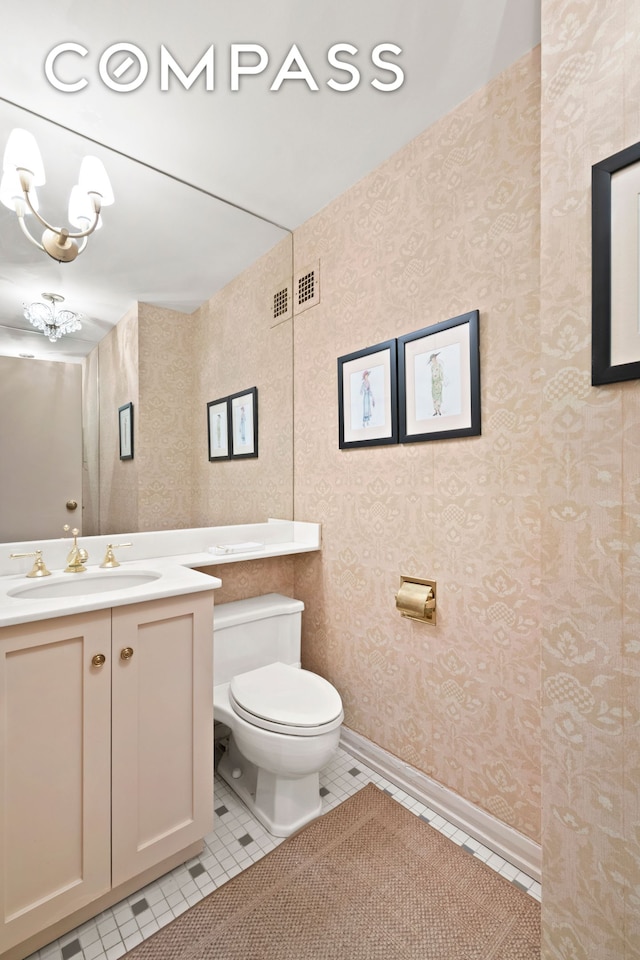 650 Park Ave Unit 18C, New York City, NY 10065 - bathroom with tile patterned flooring, vanity, and wallpapered walls