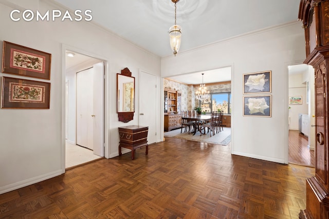 650 Park Ave Unit 18C, New York City, NY 10065 - foyer featuring a chandelier and crown molding